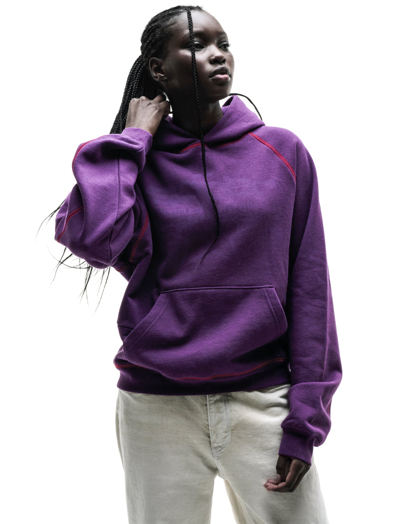 Purple SPLAT COLLISION HOODIE with red contrast stitching, kangaroo pocket, and rib knit cuffs.