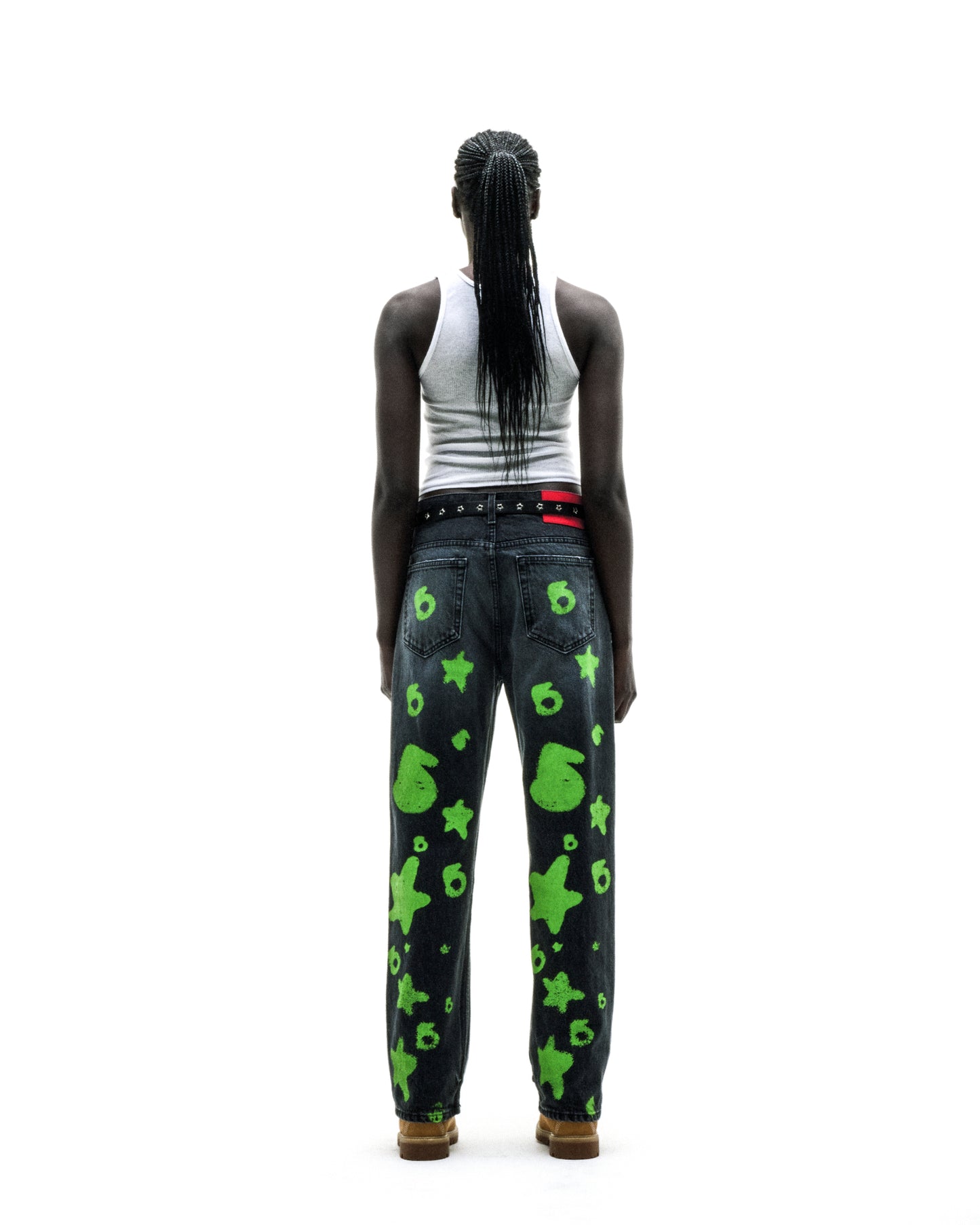 BELUGA STAMP DENIM: Faded wash denim pants with green star and "6" stamp design, custom hardware, and a branded leather back patch.