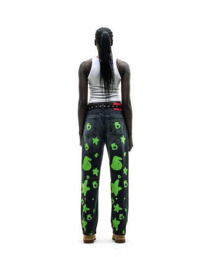 BELUGA STAMP DENIM: Faded wash denim pants with green star and "6" stamp design, custom hardware, and a branded leather back patch.
