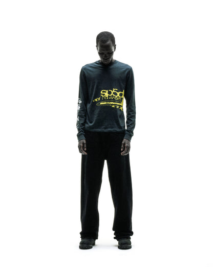Black 100% cotton long sleeve tee with yellow "sp5d worldwide" graphic print on chest and sleeves.