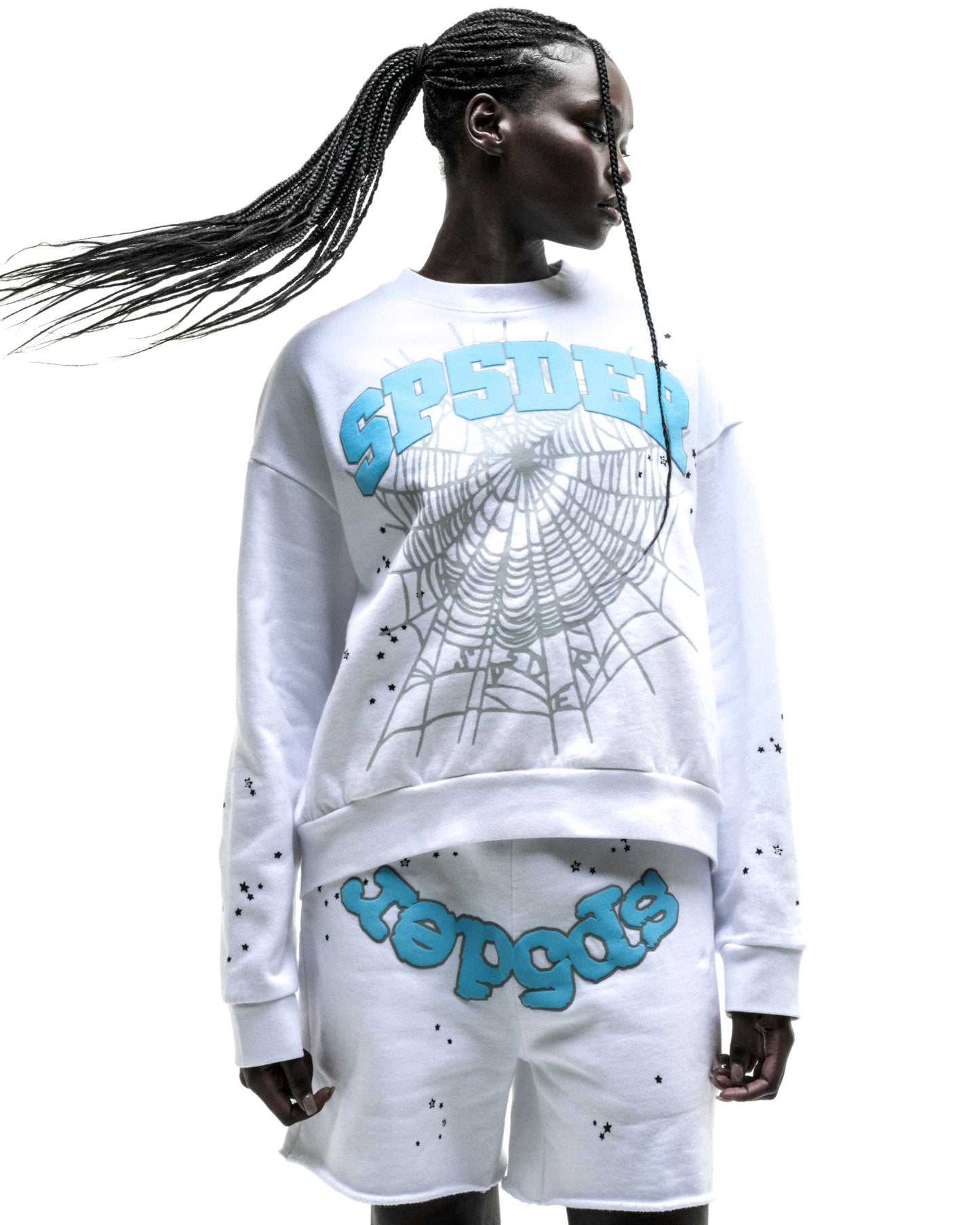 White cotton fleece crewneck with blue "SP5DER" text, spider web, and scattered star print.