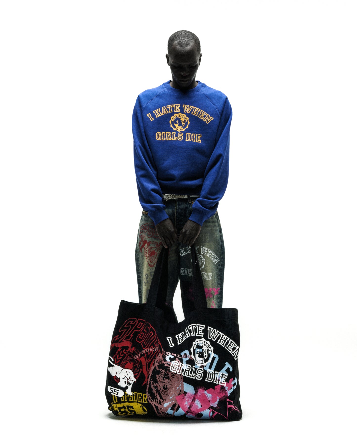 Black brushed twill tote bag with colorful graphic prints and text.