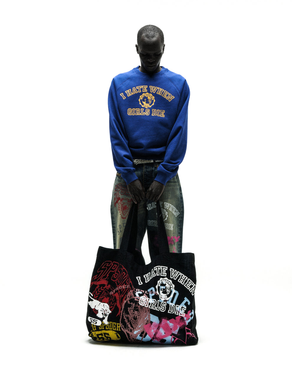 Black brushed twill tote bag with colorful graphic prints and text.