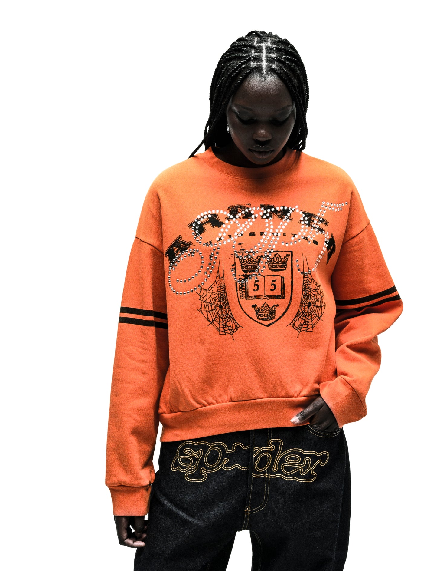 ARANEA CREWNECK: Orange crewneck sweatshirt with studded "Sp5der" logo, crest, and spiderweb graphics.
