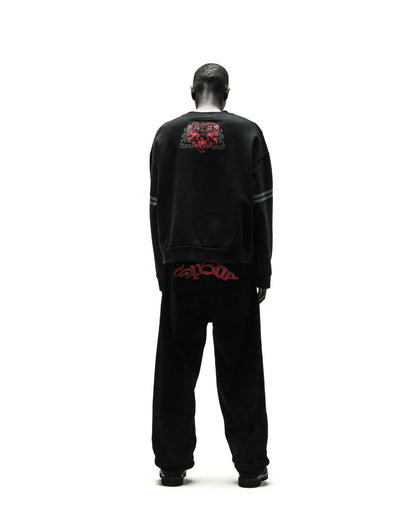 Black ARANEA CREWNECK sweatshirt with red graphic on back, paired with matching black sweatpants.